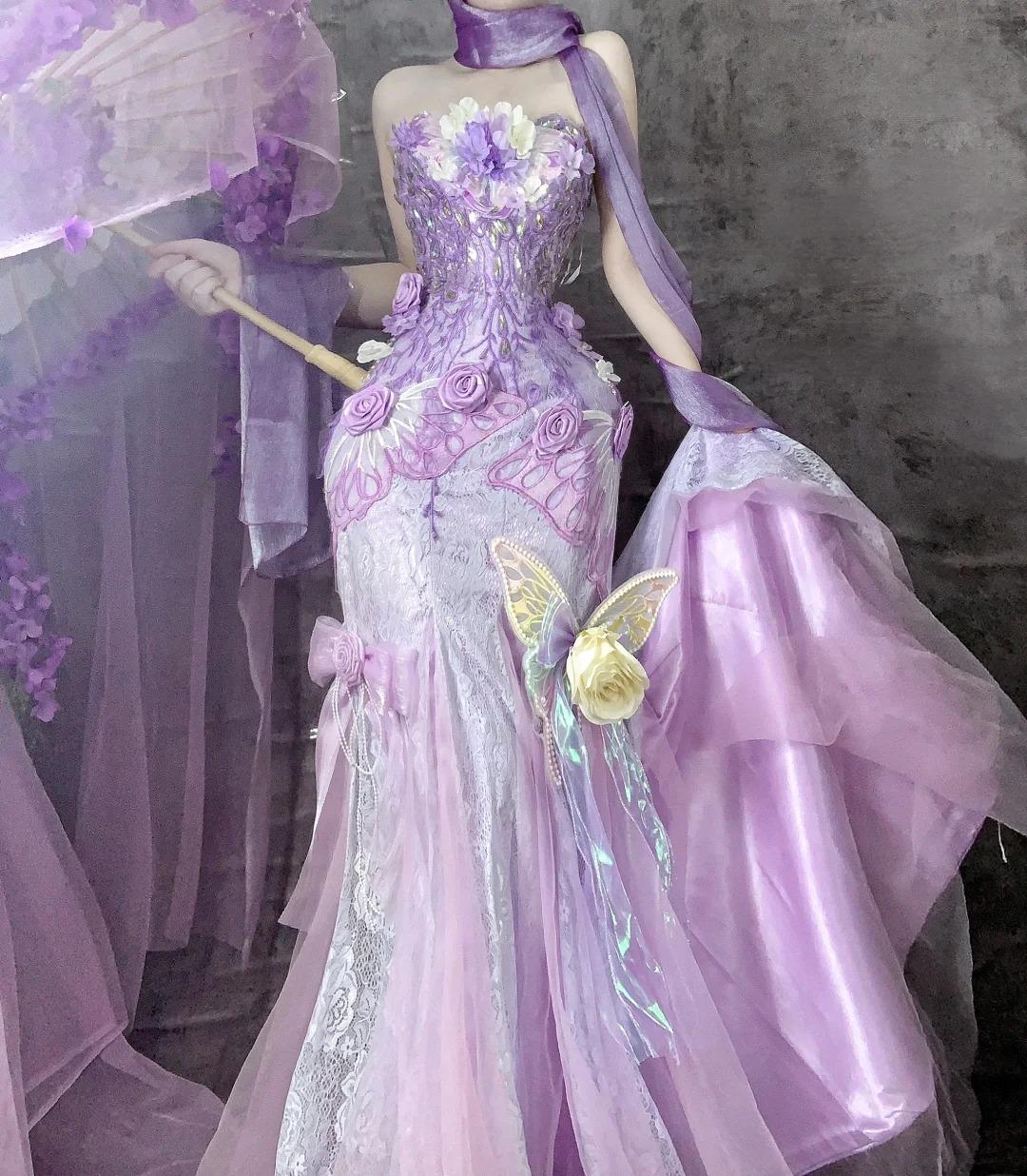 Hermoso vestido de fiesta largo de tul con apliques y corte sirena sin tirantes en morado para quinceañeras ED02501