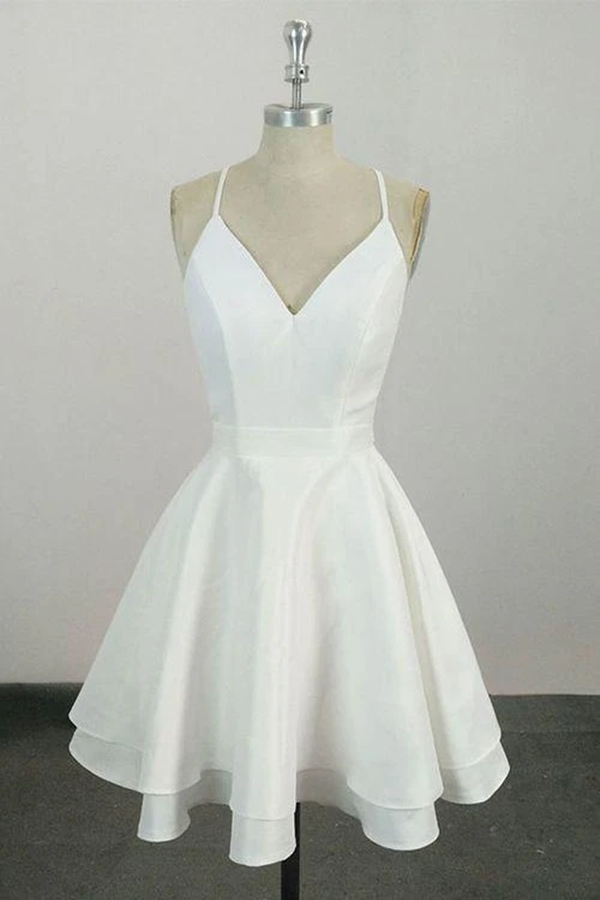 Vestido de cóctel corto con tirantes finos, escote en V y largo hasta la rodilla. Vestidos de fiesta.
