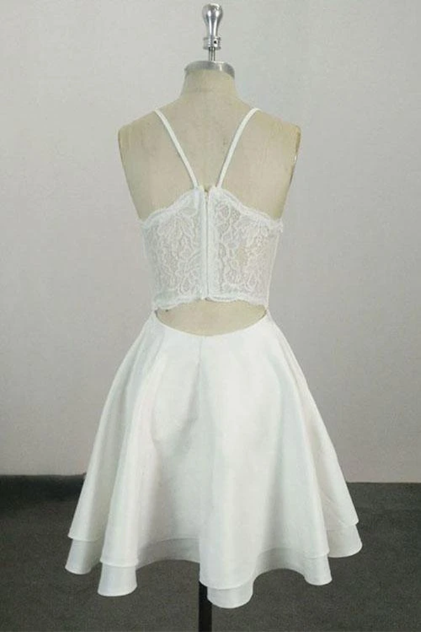 Vestido de cóctel corto con tirantes finos, escote en V y largo hasta la rodilla. Vestidos de fiesta.